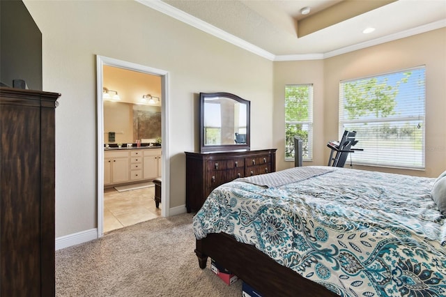 6934 Old Benton Dr, Apollo Beach, FL 33572 - bedroom featuring crown molding, light carpet, light tile patterned floors, ensuite bath, and a raised ceiling