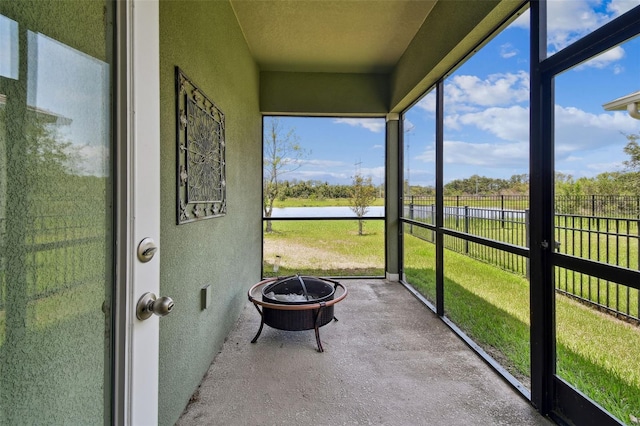 6934 Old Benton Dr, Apollo Beach, FL 33572 - sunroom featuring a fire pit and a water view