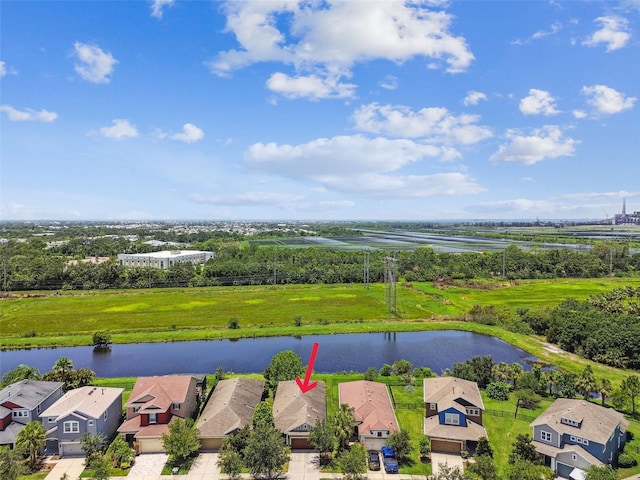6934 Old Benton Dr, Apollo Beach, FL 33572 - aerial perspective of suburban area with a large body of water and a tree filled landscape