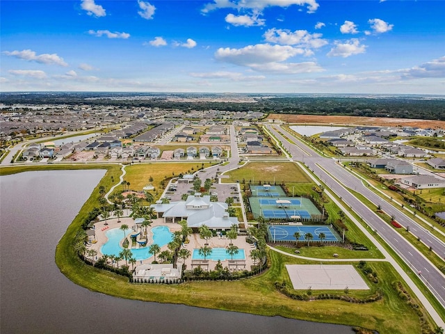 6934 Old Benton Dr, Apollo Beach, FL 33572 - aerial perspective of suburban area featuring a pool area and a nearby body of water