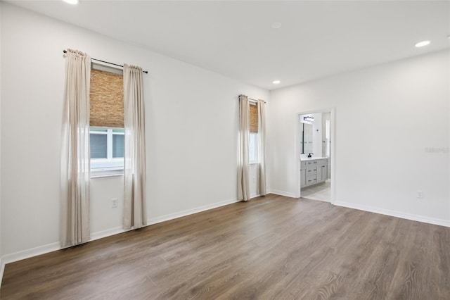 33157 Rosewood Bark Way, Wesley Chapel, FL 33545 - spare room featuring wood finished floors and recessed lighting
