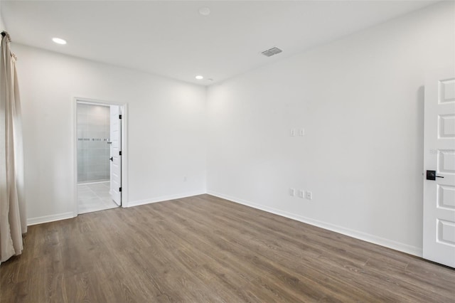 33157 Rosewood Bark Way, Wesley Chapel, FL 33545 - unfurnished room featuring wood finished floors and recessed lighting