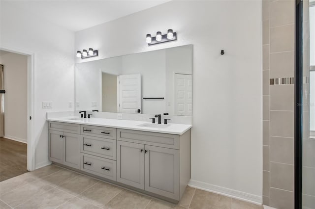 33157 Rosewood Bark Way, Wesley Chapel, FL 33545 - full bath featuring double vanity and tile patterned flooring