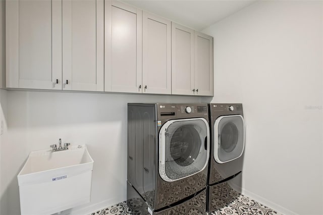 33157 Rosewood Bark Way, Wesley Chapel, FL 33545 - laundry area with separate washer and dryer and cabinet space