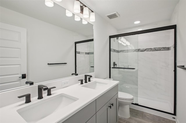 33157 Rosewood Bark Way, Wesley Chapel, FL 33545 - bathroom with a marble finish shower and double vanity
