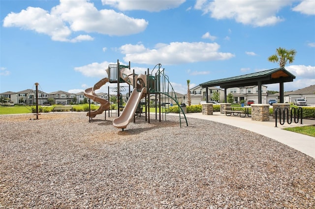 33157 Rosewood Bark Way, Wesley Chapel, FL 33545 - community jungle gym featuring a residential view