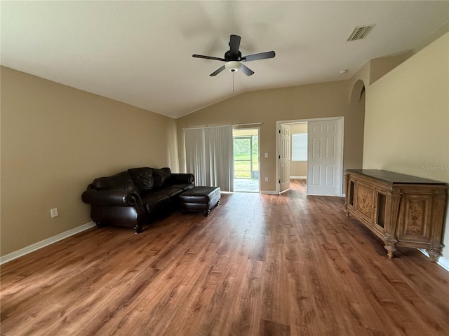 7201 Royal George Ct, Wesley Chapel, FL 33545 - living area featuring wood finished floors, lofted ceiling, arched walkways, and a ceiling fan