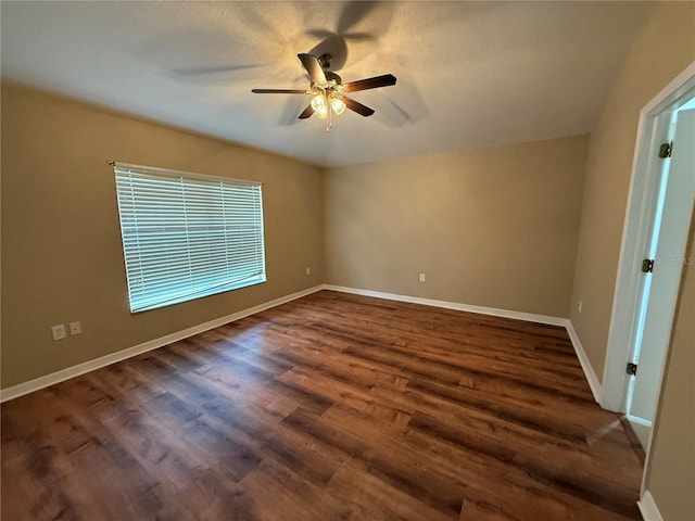 7201 Royal George Ct, Wesley Chapel, FL 33545 - empty room with a ceiling fan and dark wood-type flooring