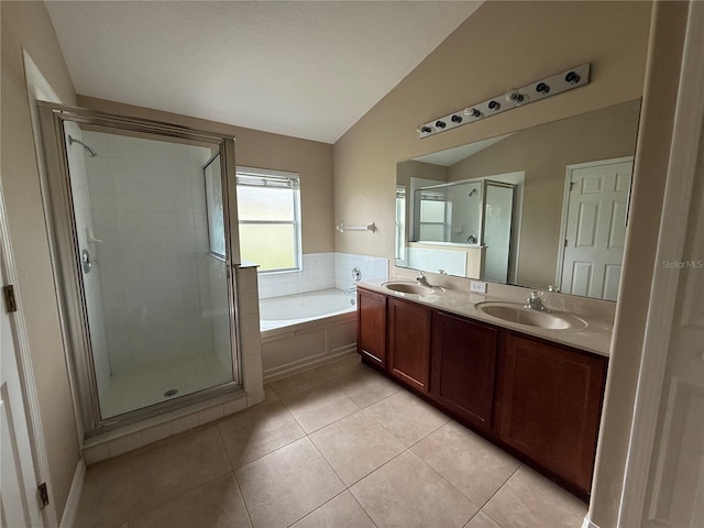 7201 Royal George Ct, Wesley Chapel, FL 33545 - bathroom featuring vaulted ceiling, a shower stall, a bath, double vanity, and tile patterned floors