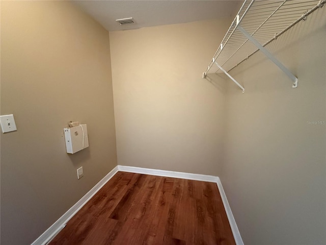7201 Royal George Ct, Wesley Chapel, FL 33545 - walk in closet featuring dark wood finished floors