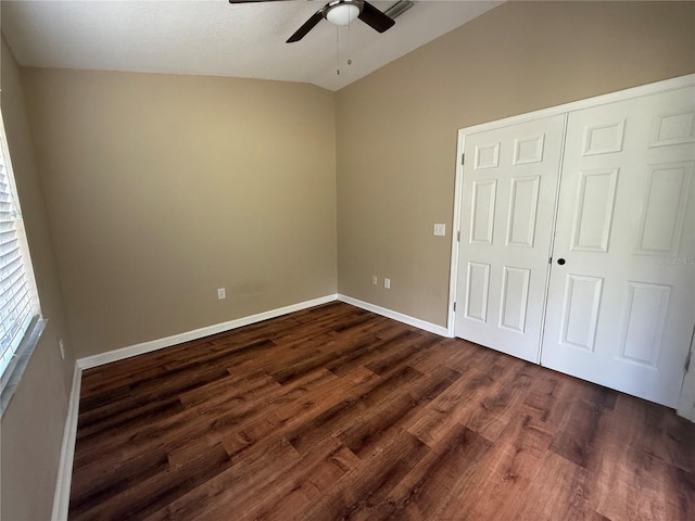 7201 Royal George Ct, Wesley Chapel, FL 33545 - unfurnished bedroom featuring vaulted ceiling, dark wood-style floors, ceiling fan, and a closet