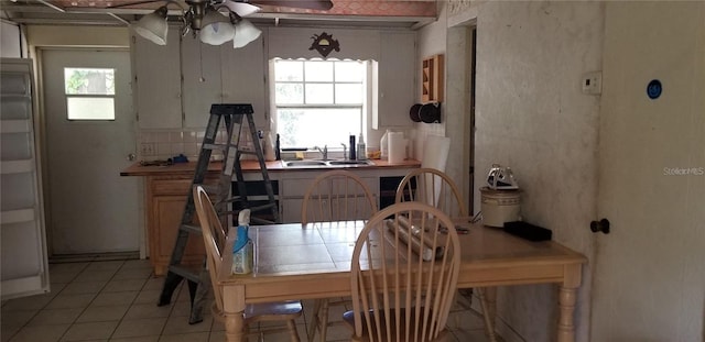 508 Dartmouth Ave E, Oldsmar, FL 34677 - dining area featuring a ceiling fan and light tile patterned flooring