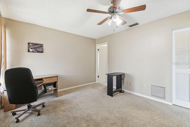 8030 San Bernardino Dr, Port Richey, FL 34668 - carpeted office space featuring a ceiling fan and a textured ceiling