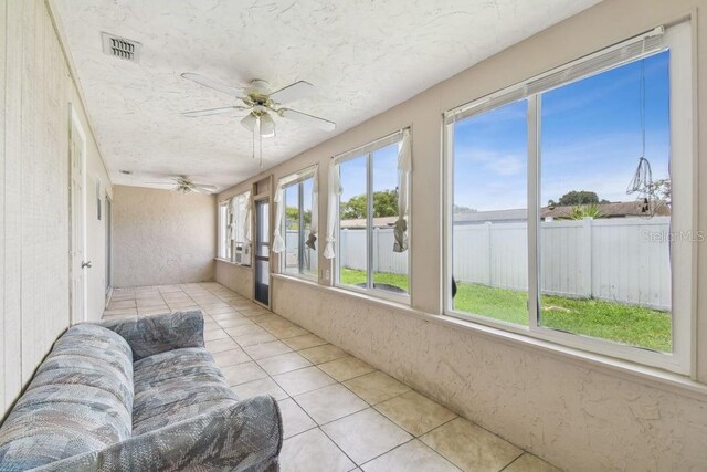8030 San Bernardino Dr, Port Richey, FL 34668 - sunroom / solarium with a textured ceiling and tile patterned flooring
