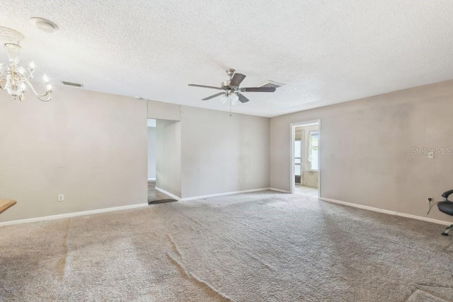 8030 San Bernardino Dr, Port Richey, FL 34668 - unfurnished room with a ceiling fan, a textured ceiling, a chandelier, and carpet