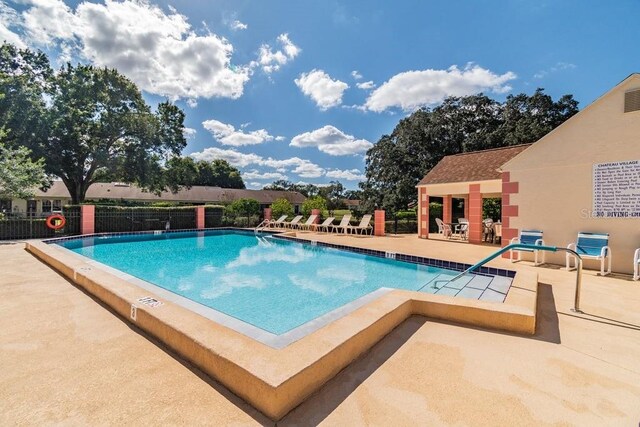 8030 San Bernardino Dr, Port Richey, FL 34668 - community pool with a patio area