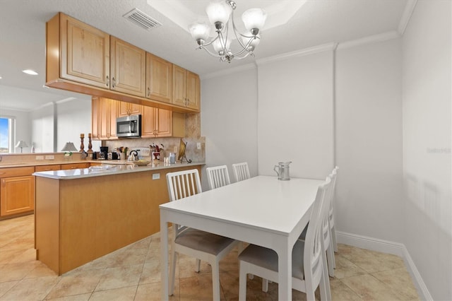 7296 Marathon Dr Unit 603, Seminole, FL 33777 - dining area with crown molding, a chandelier, recessed lighting, and light tile patterned floors