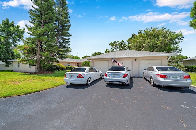 2182 Corinne Ct S Unit C, Saint Petersburg, FL 33712 - view of front of home with a garage and a front yard
