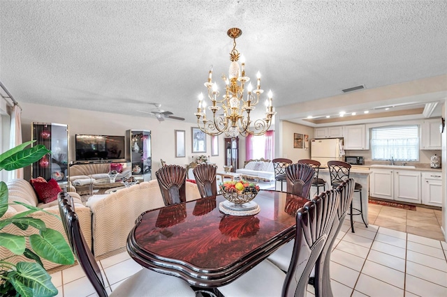 2182 Corinne Ct S Unit C, Saint Petersburg, FL 33712 - dining space featuring a chandelier, light tile patterned floors, a textured ceiling, and ceiling fan