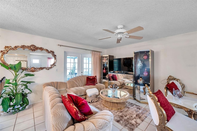 2182 Corinne Ct S Unit C, Saint Petersburg, FL 33712 - living area with tile patterned floors, a ceiling fan, and a textured ceiling