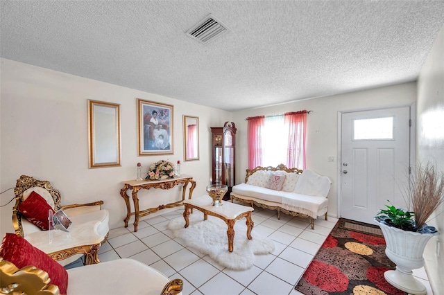 2182 Corinne Ct S Unit C, Saint Petersburg, FL 33712 - living area featuring a textured ceiling and light tile patterned floors