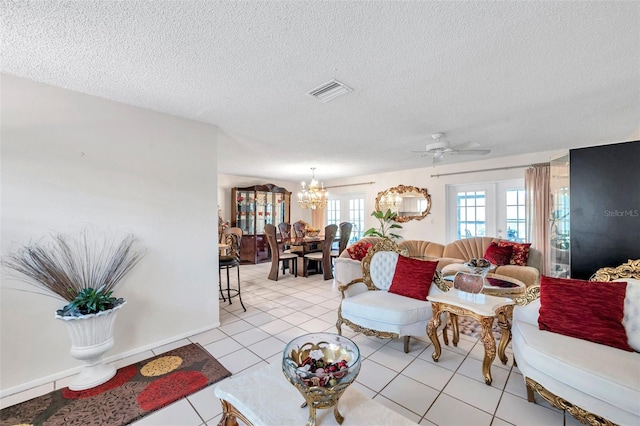 2182 Corinne Ct S Unit C, Saint Petersburg, FL 33712 - living room with a chandelier, a textured ceiling, a ceiling fan, and light tile patterned floors
