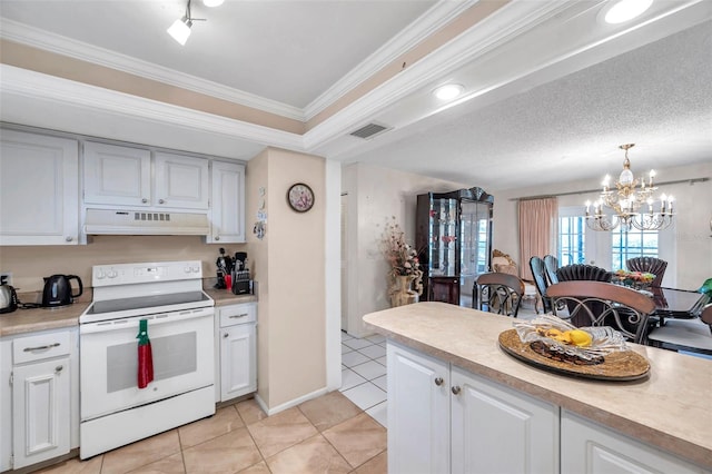 2182 Corinne Ct S Unit C, Saint Petersburg, FL 33712 - kitchen with electric stove, under cabinet range hood, light countertops, light tile patterned floors, and a chandelier