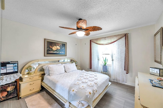 2182 Corinne Ct S Unit C, Saint Petersburg, FL 33712 - bedroom with a textured ceiling and a ceiling fan