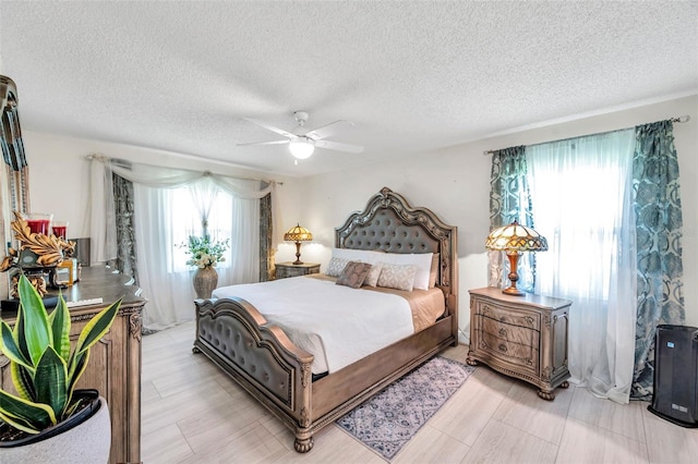 2182 Corinne Ct S Unit C, Saint Petersburg, FL 33712 - bedroom featuring a textured ceiling and ceiling fan