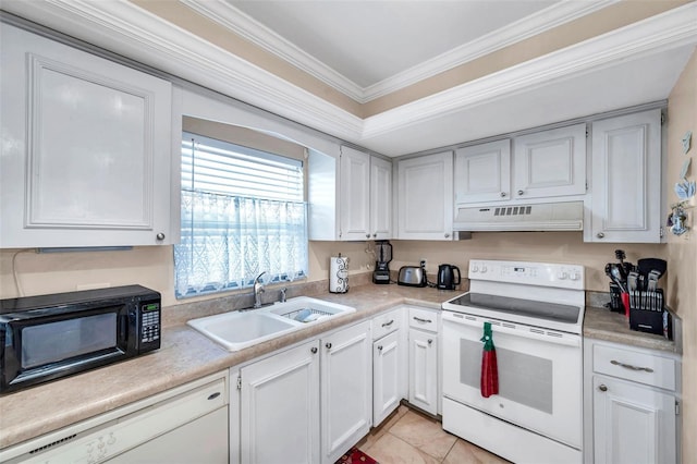 2182 Corinne Ct S Unit C, Saint Petersburg, FL 33712 - kitchen with white appliances, under cabinet range hood, crown molding, light countertops, and white cabinets