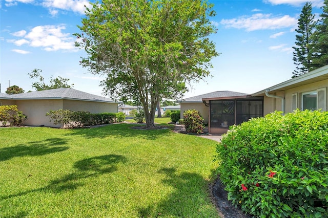 2182 Corinne Ct S Unit C, Saint Petersburg, FL 33712 - view of grassy yard featuring a sunroom