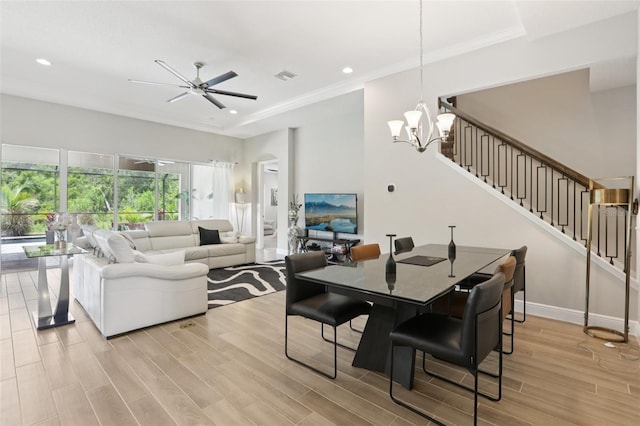 5426 Wayfarer Ave, Apollo Beach, FL 33572 - dining room with stairs, a ceiling fan, light wood finished floors, a chandelier, and recessed lighting