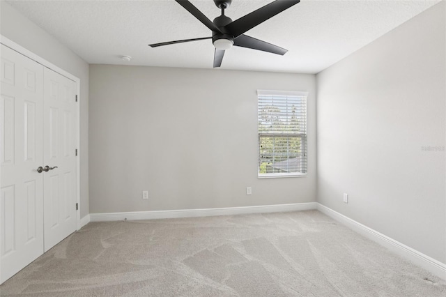 5426 Wayfarer Ave, Apollo Beach, FL 33572 - unfurnished bedroom with light colored carpet, a ceiling fan, and a closet