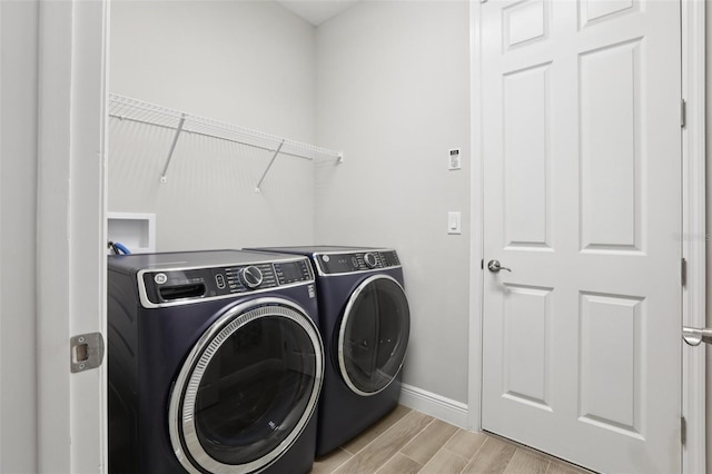 5426 Wayfarer Ave, Apollo Beach, FL 33572 - laundry area featuring separate washer and dryer and light wood-style floors