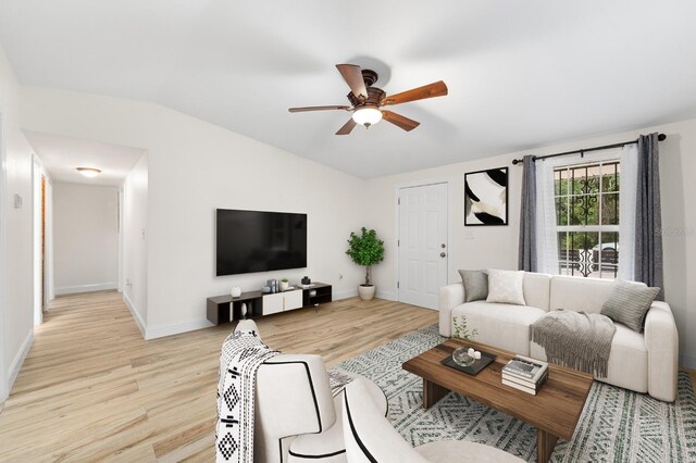 1905 E 99th Ave, Tampa, FL 33612 - living area with light wood-style flooring, ceiling fan, and lofted ceiling
