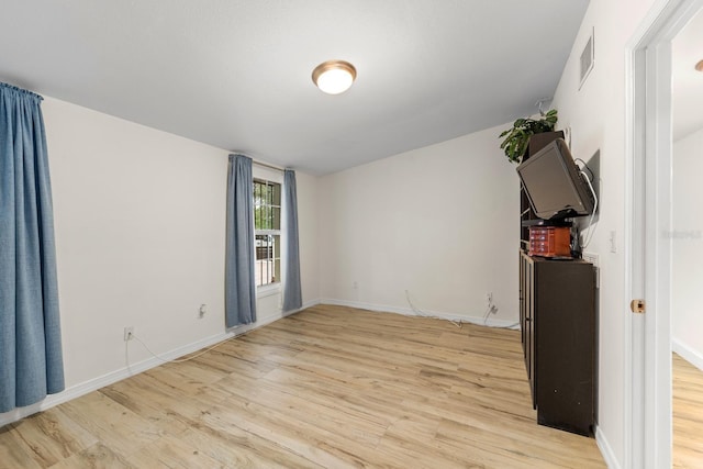 1905 E 99th Ave, Tampa, FL 33612 - unfurnished room featuring light wood-type flooring