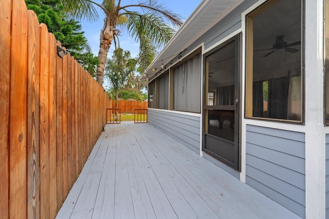 1905 E 99th Ave, Tampa, FL 33612 - wooden terrace with a sunroom