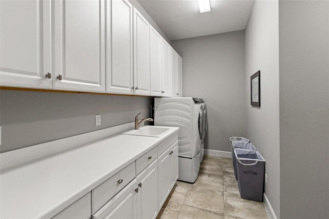 1507 Amarone Pl, Lutz, FL 33548 - laundry area featuring cabinet space, independent washer and dryer, and light stone finish flooring