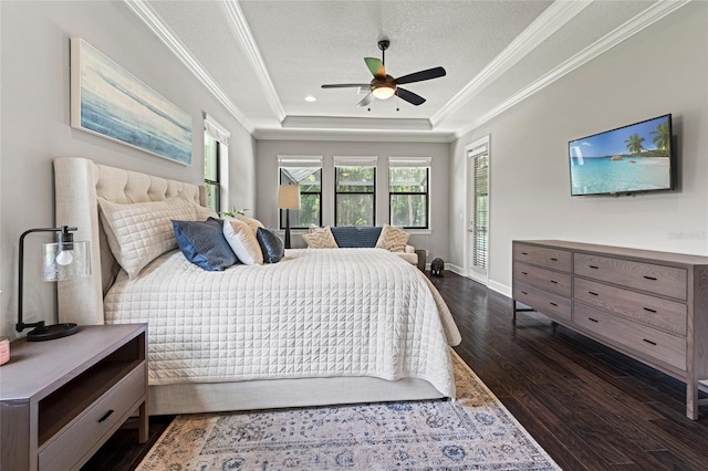 1507 Amarone Pl, Lutz, FL 33548 - bedroom with a tray ceiling, dark wood-type flooring, crown molding, recessed lighting, and a ceiling fan