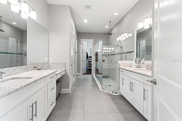 1507 Amarone Pl, Lutz, FL 33548 - full bath with a stall shower, two vanities, tile patterned floors, and recessed lighting