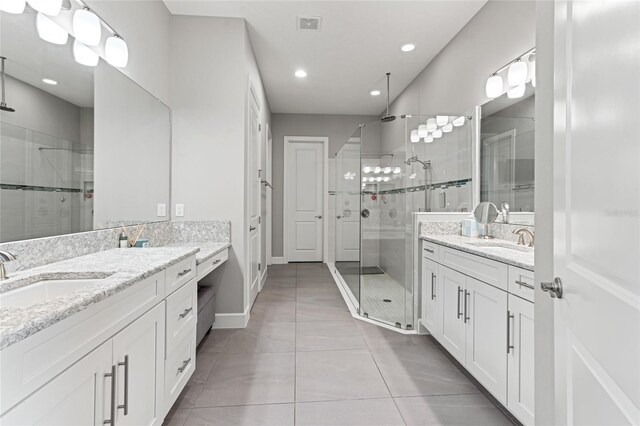 1507 Amarone Pl, Lutz, FL 33548 - full bathroom featuring a stall shower, two vanities, tile patterned floors, and recessed lighting