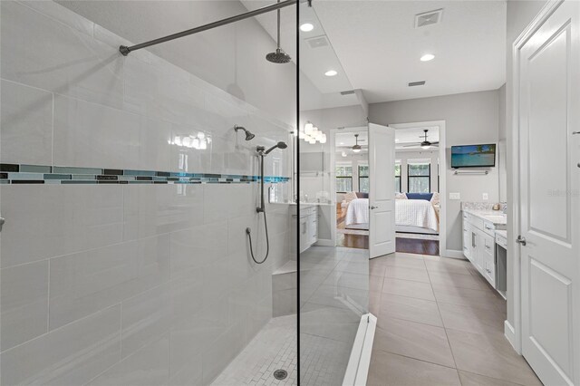 1507 Amarone Pl, Lutz, FL 33548 - ensuite bathroom with ceiling fan, tiled shower, vanity, recessed lighting, and tile patterned flooring