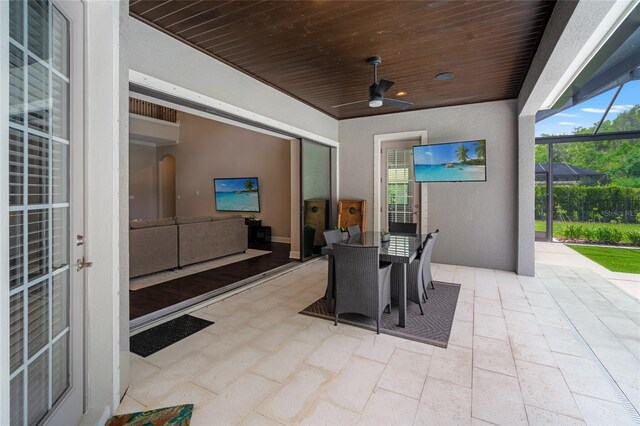 1507 Amarone Pl, Lutz, FL 33548 - view of patio featuring a ceiling fan, a lanai, and outdoor dining area