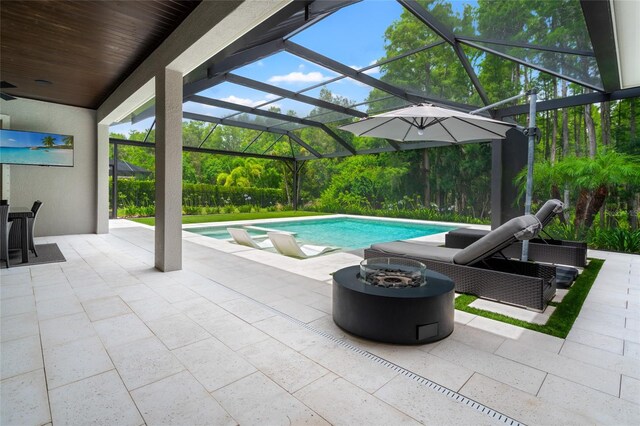 1507 Amarone Pl, Lutz, FL 33548 - view of pool featuring a fire pit, a patio, a lanai, and a ceiling fan