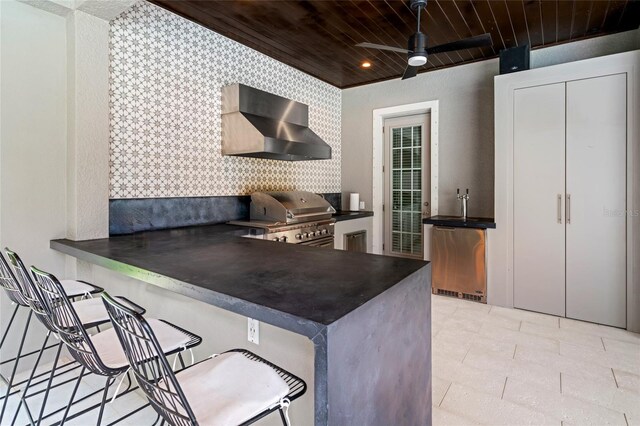 1507 Amarone Pl, Lutz, FL 33548 - kitchen featuring wall chimney exhaust hood, dark countertops, refrigerator, wooden ceiling, and a ceiling fan