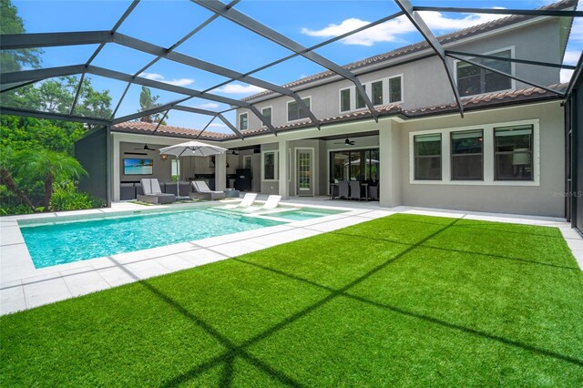 1507 Amarone Pl, Lutz, FL 33548 - rear view of house featuring a ceiling fan, an outdoor hangout area, a yard, stucco siding, and an outdoor pool