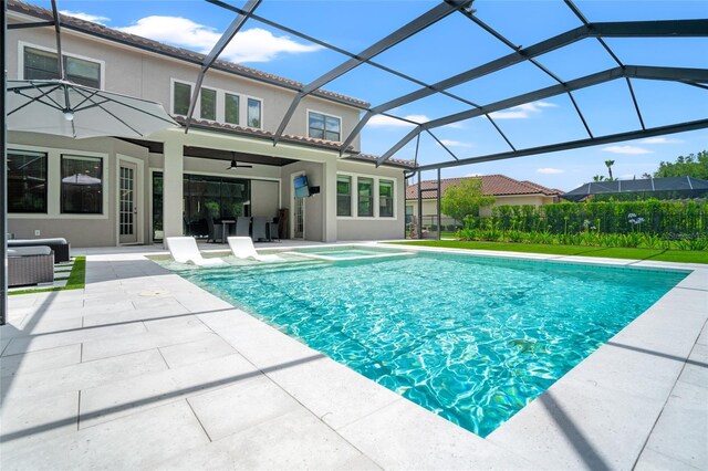 1507 Amarone Pl, Lutz, FL 33548 - view of pool featuring a patio, a ceiling fan, glass enclosure, and a pool with connected hot tub