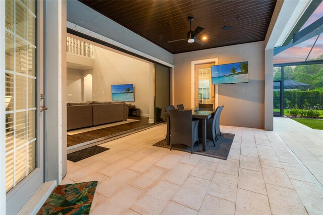 1507 Amarone Pl, Lutz, FL 33548 - view of patio with a ceiling fan, glass enclosure, and outdoor dining area