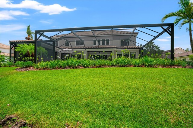 1507 Amarone Pl, Lutz, FL 33548 - back of property with a yard, a lanai, and stucco siding