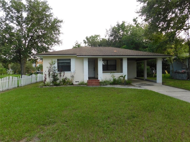 507 Francis Blvd, Lakeland, FL 33801 - ranch-style home with concrete driveway and a carport